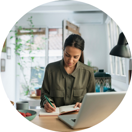 Woman writing on notebook